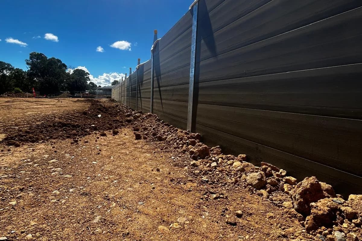 Long retaining wall with sun flare
