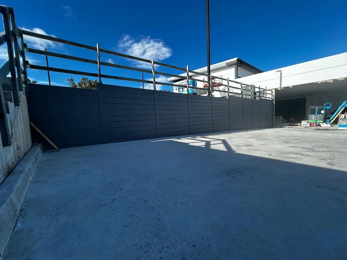 Completed charcoal retaining wall around a commercial courtyard
