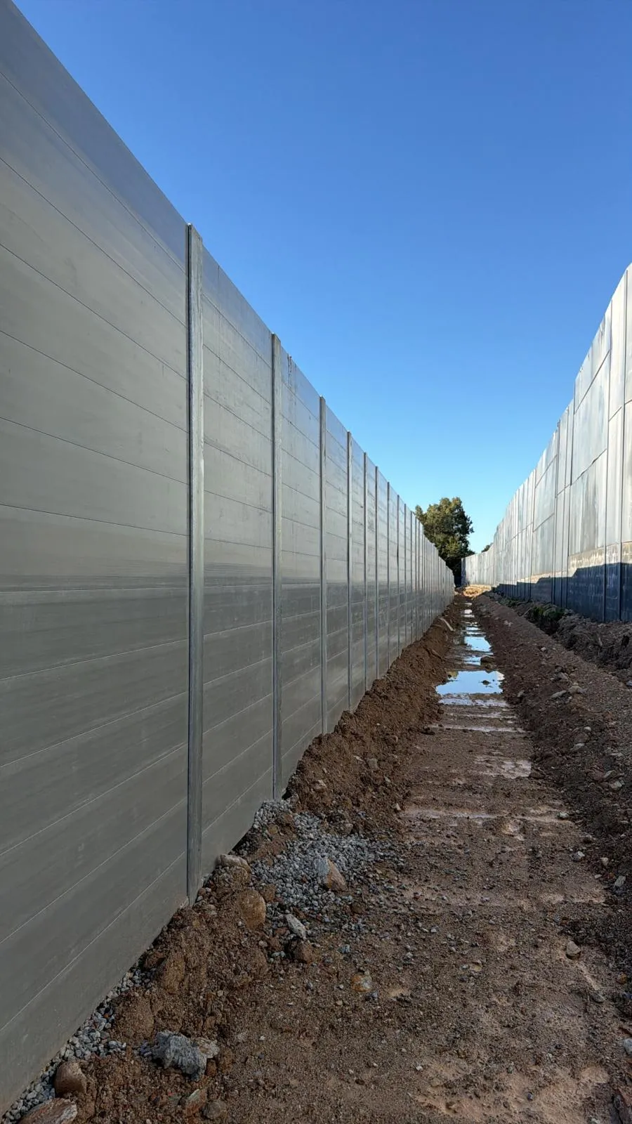 Long SuperSleeper wall with drainage trench